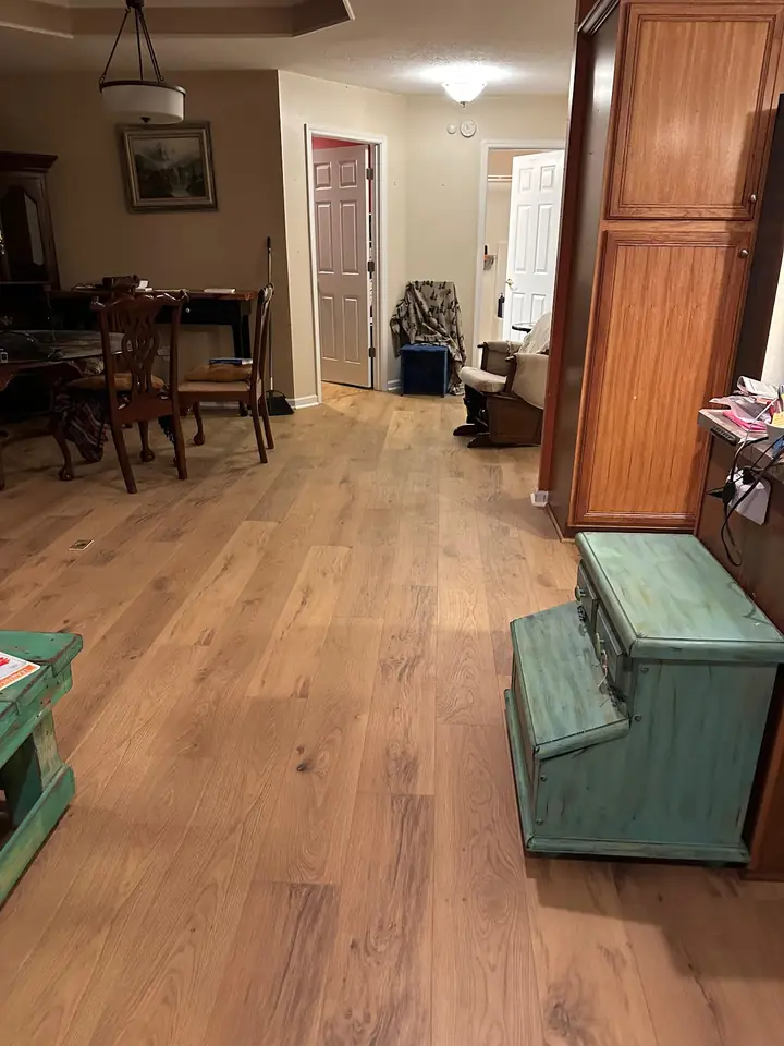 New wood flooring through the dining area of a Lonsdale home