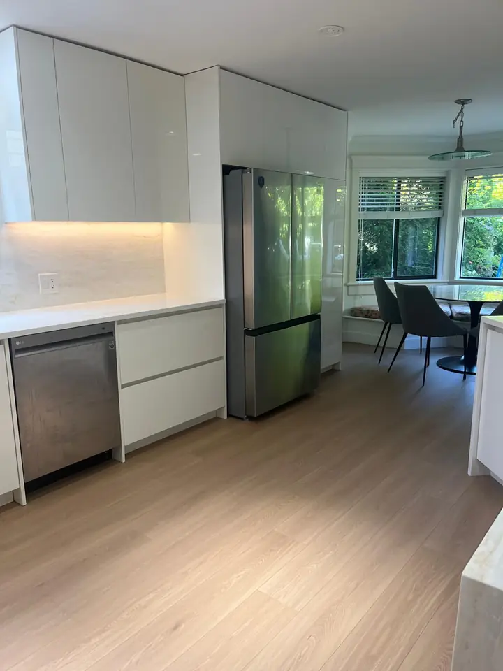The renovated North Vancouver kitchen opening onto the dining area