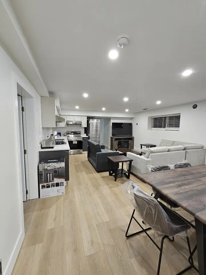 UBC-area home renovation: open living and kitchen space with new plank flooring