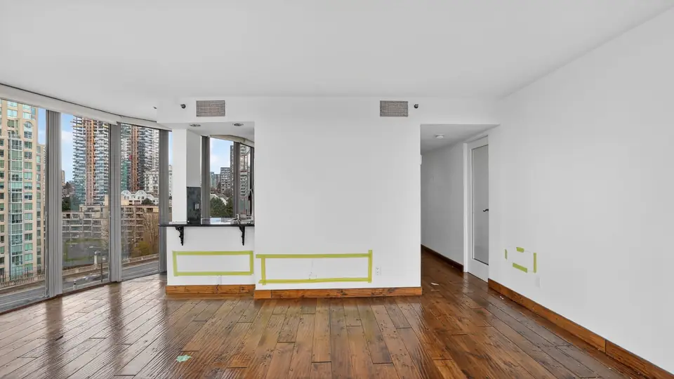Yaletown living area before the remodel, with the original dark hardwood floor